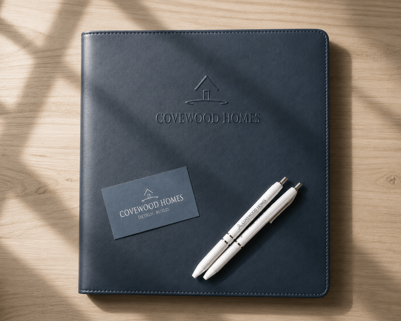 Covewood Homes welcome binder with branded stationery.